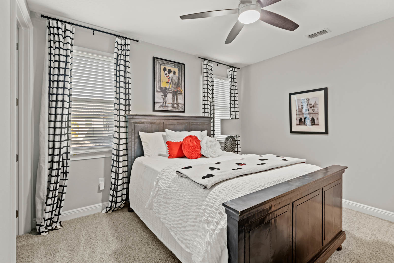 bedroom with two windows and a bed